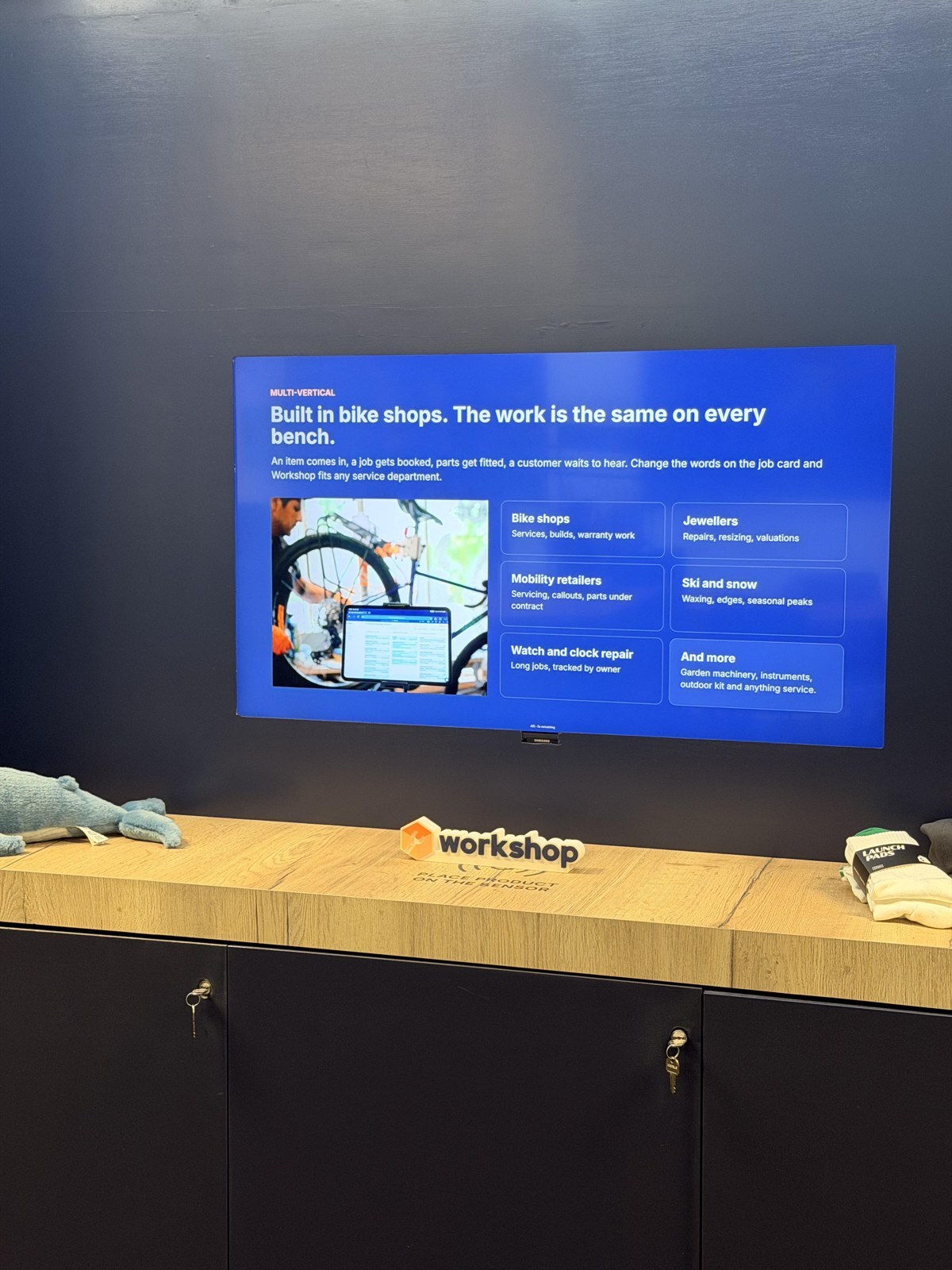 The trades Workshop works for, on the screen in the London store