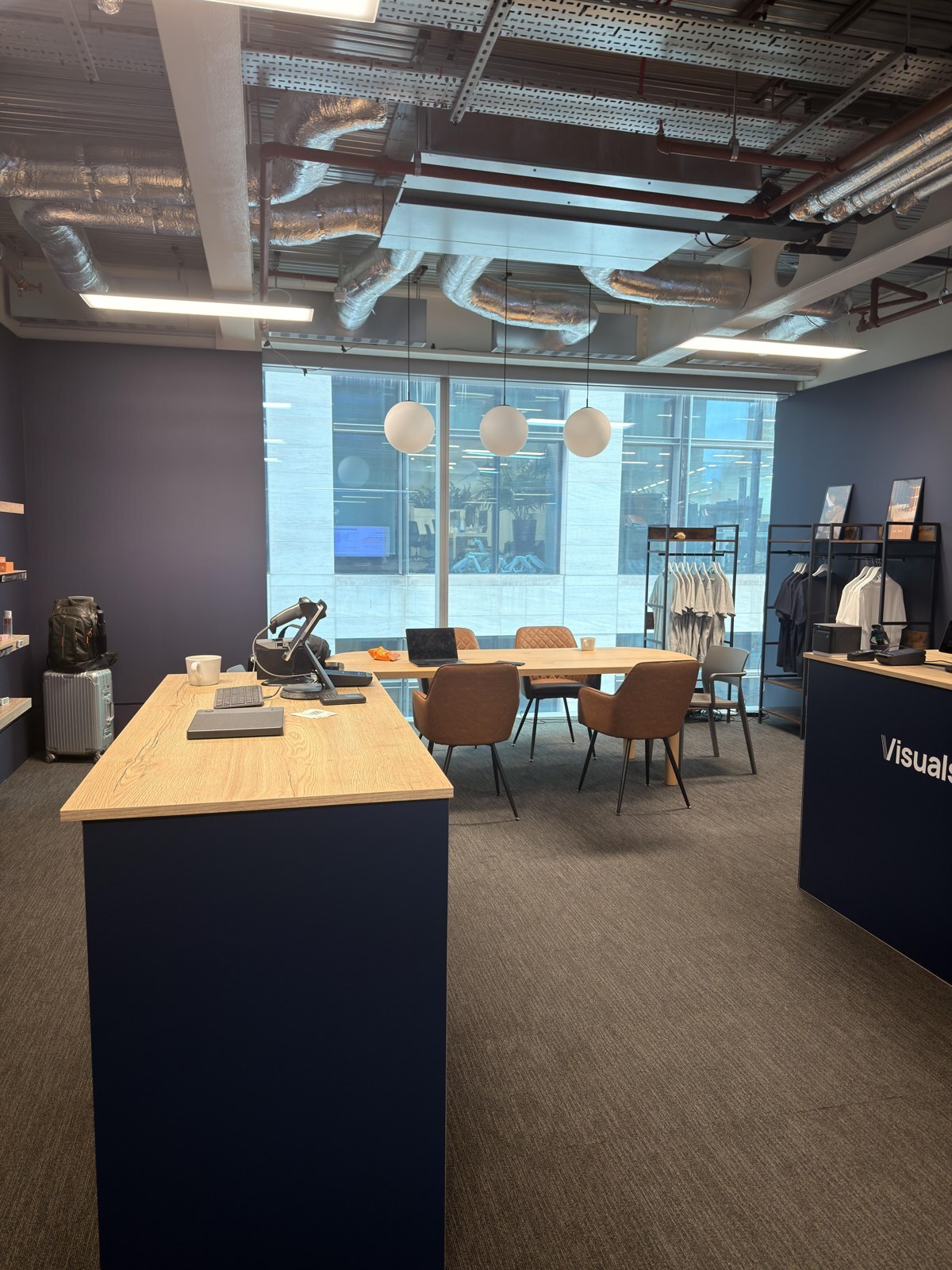 The London live store, with the counter, rails and meeting table