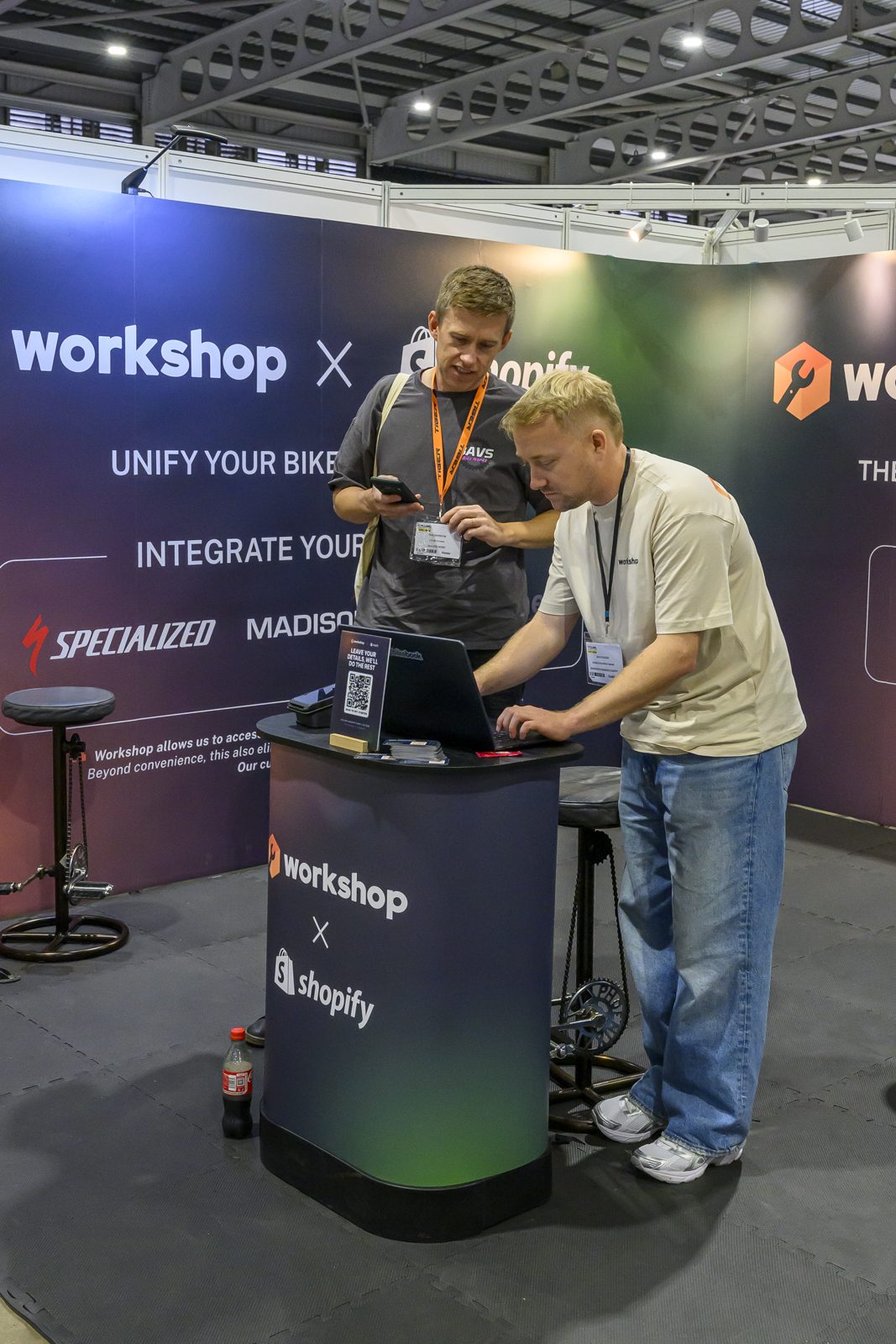 A visitor watching a Workshop demo on the stand